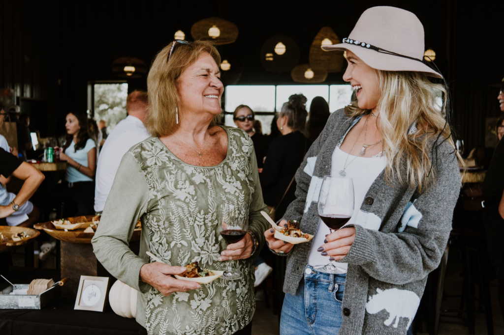 Guests with wine in the Main Tasting Room during a private event